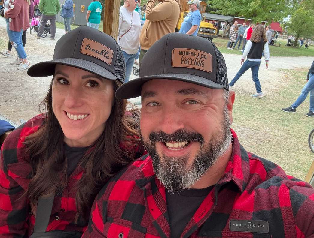 couple with hats and custom patches