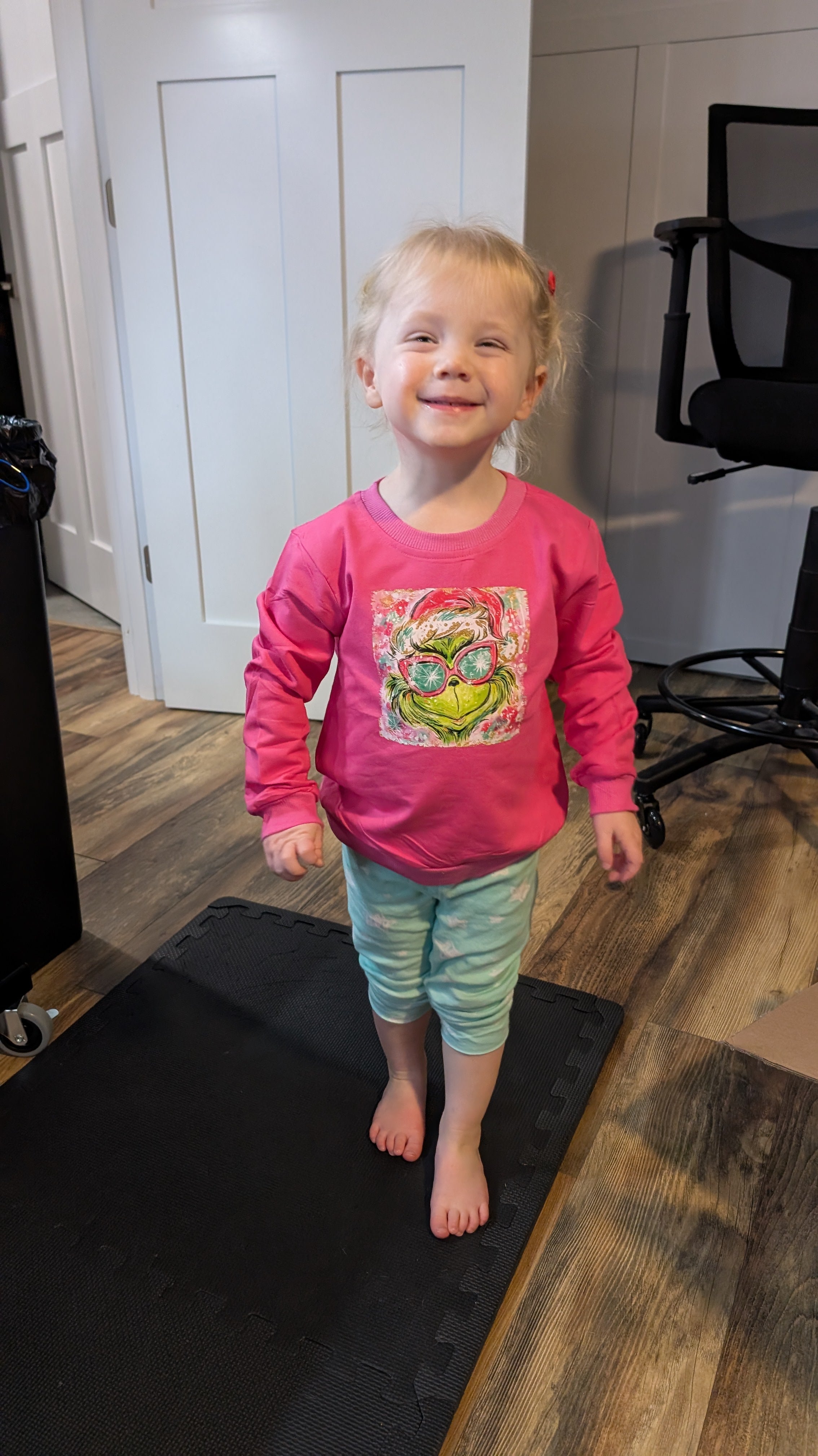 child with grinch shirt